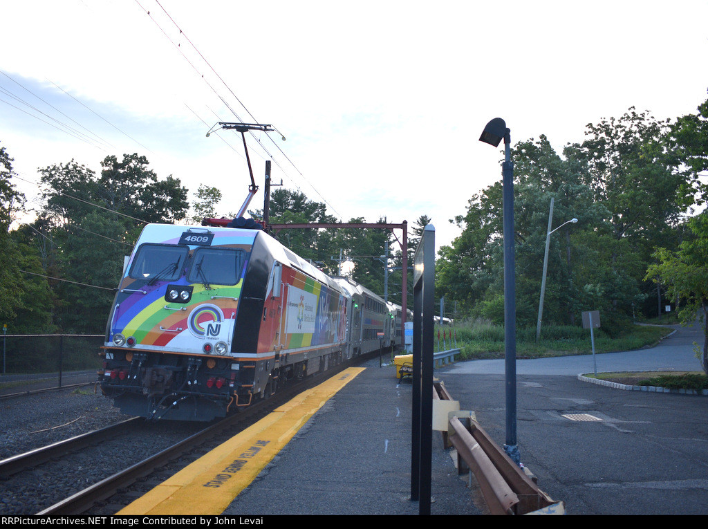 ALP-46 # 4609 in the Pride Colors pushes NJT Train # 6437 out of the depot toward Gladstone 